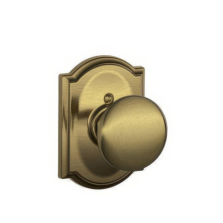 Schlage F170PLY609CAM antique brass dummy door knob