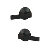 Schlage FC172NBK716KIN aged bronze pair of dummy door lever