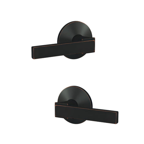 Schlage FC172NBK716KIN aged bronze pair of dummy door lever