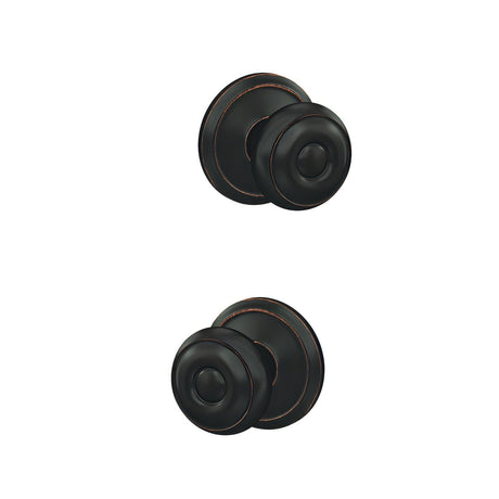 Schlage FC21GEO716ALD aged bronze passage & privacy door knob