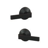 Schlage FC21NBK716KIN aged bronze passage & privacy door lever